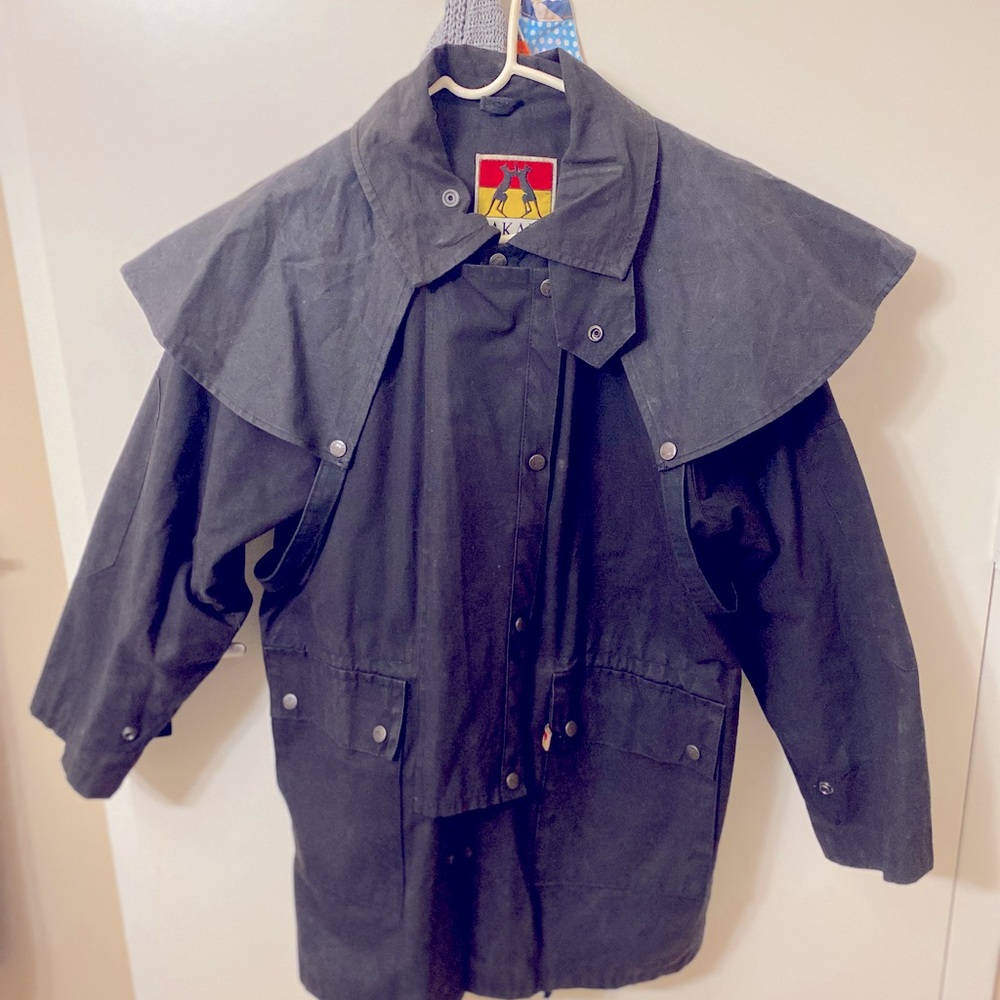 One Black Oilskin Duster Kakadu Traders. Fits like a US mens Medium.